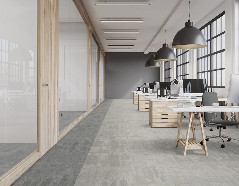 Corridor with carpet tiles in a contrasting tone marking the route through the building